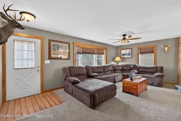 a living room with furniture and a window