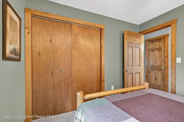 a view of a room with a wooden door