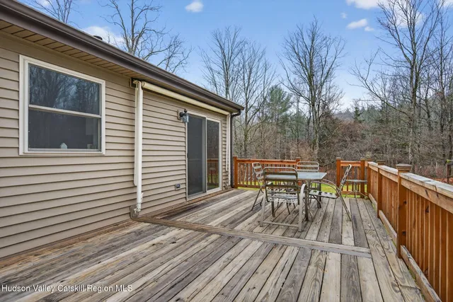 a view of empty room with lots of trees