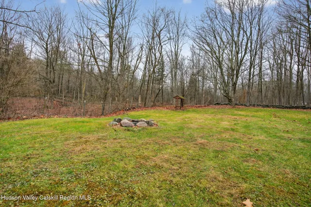 a view of outdoor space with deck and trees