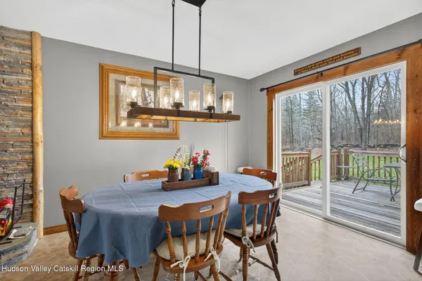 a view of a dining room with furniture window and outside view