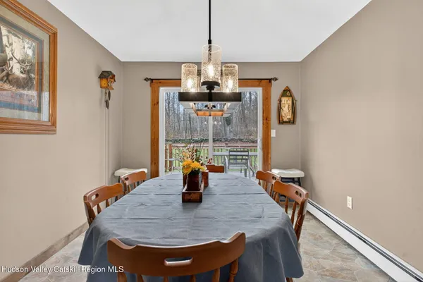 a dining room with furniture and window