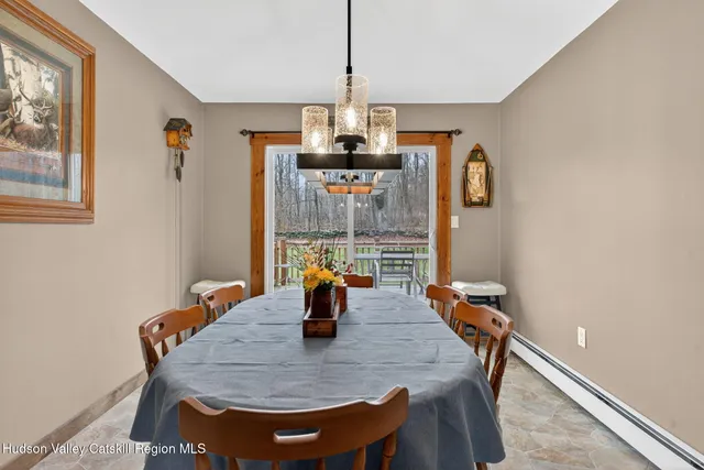a dining room with furniture and window