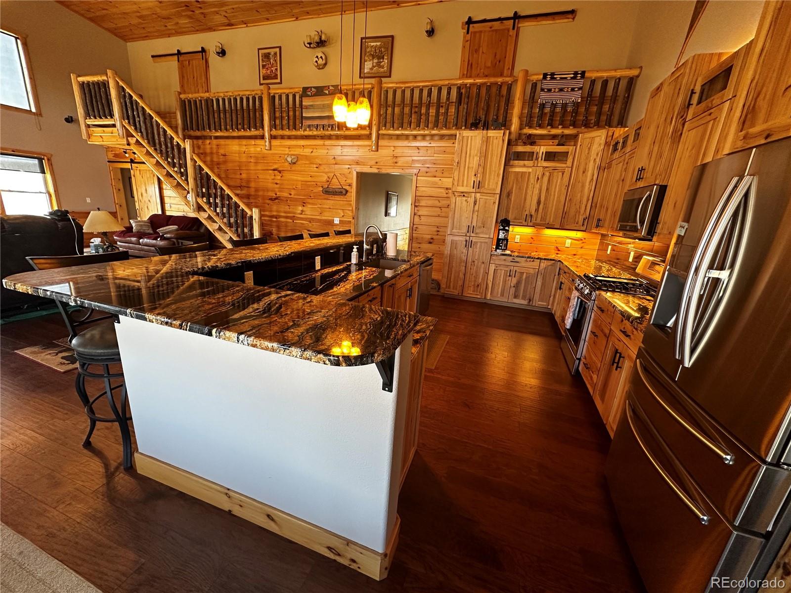 3744 Icehouse Road Fort Garland, CO 81133 - Photo 11 of 48 a view of a room with wooden floor