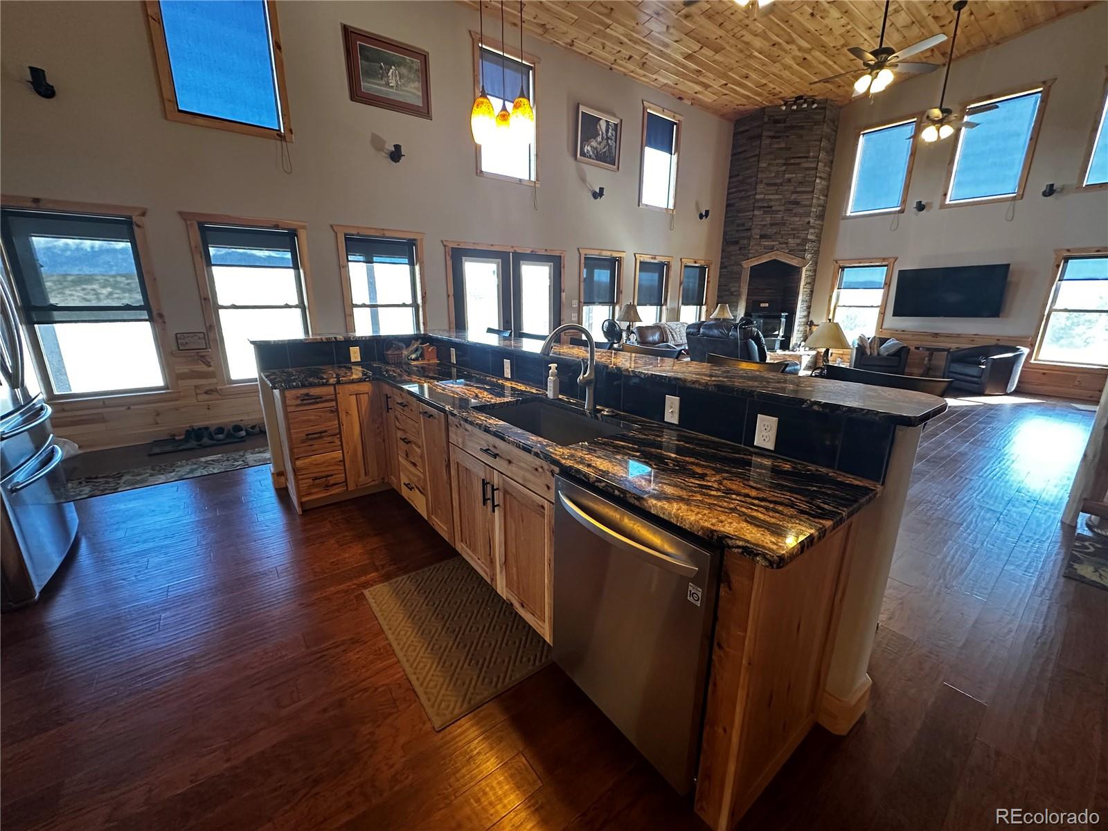 3744 Icehouse Road Fort Garland, CO 81133 - Photo 13 of 48 a kitchen with lots of counter top space and wooden floor