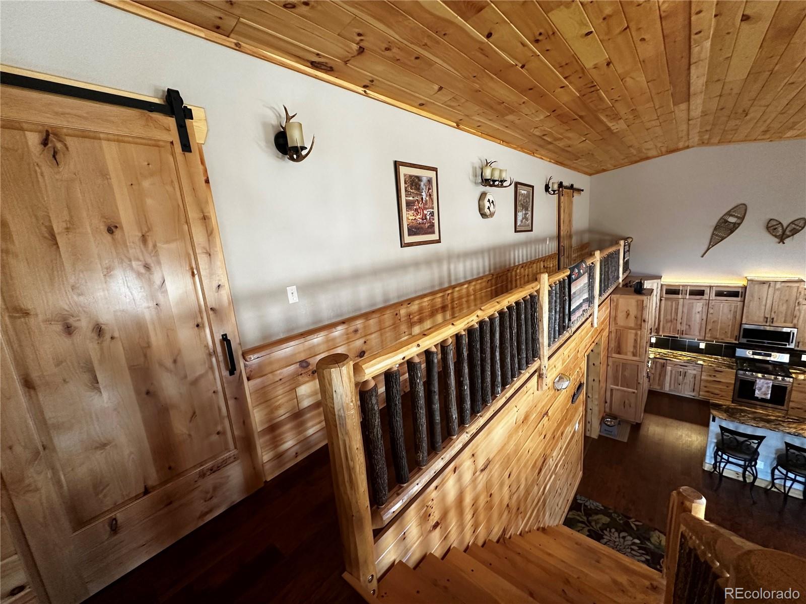 3744 Icehouse Road Fort Garland, CO 81133 - Photo 14 of 48 a view of a hallway with stairs