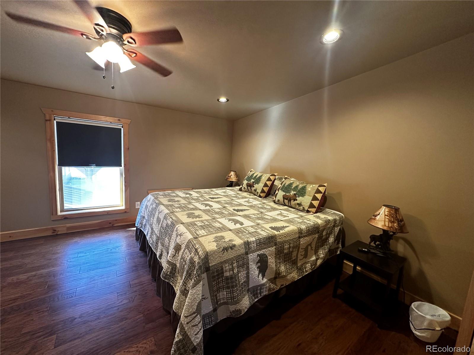 3744 Icehouse Road Fort Garland, CO 81133 - Photo 20 of 48 a bedroom with a bed and a chandelier
