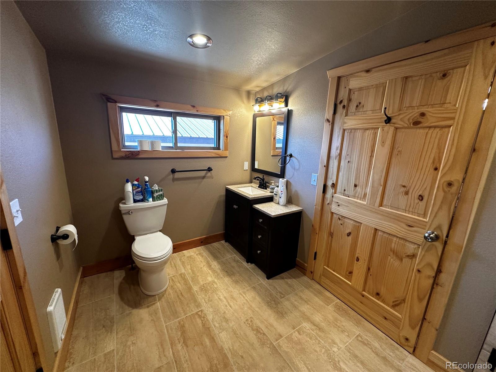 3744 Icehouse Road Fort Garland, CO 81133 - Photo 26 of 48 a bathroom with a sink toilet and shower