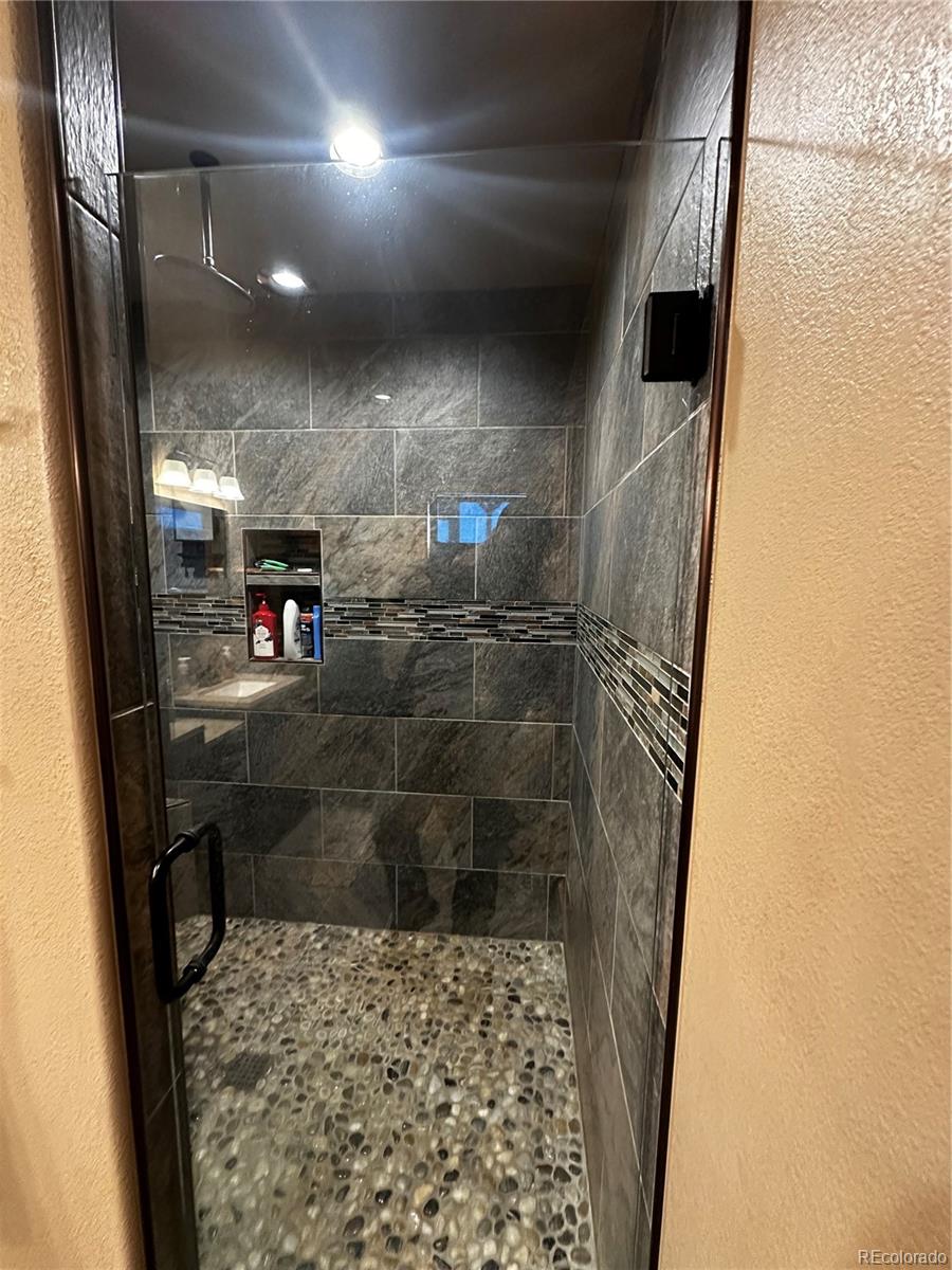 3744 Icehouse Road Fort Garland, CO 81133 - Photo 32 of 48 a bathroom with a shower
