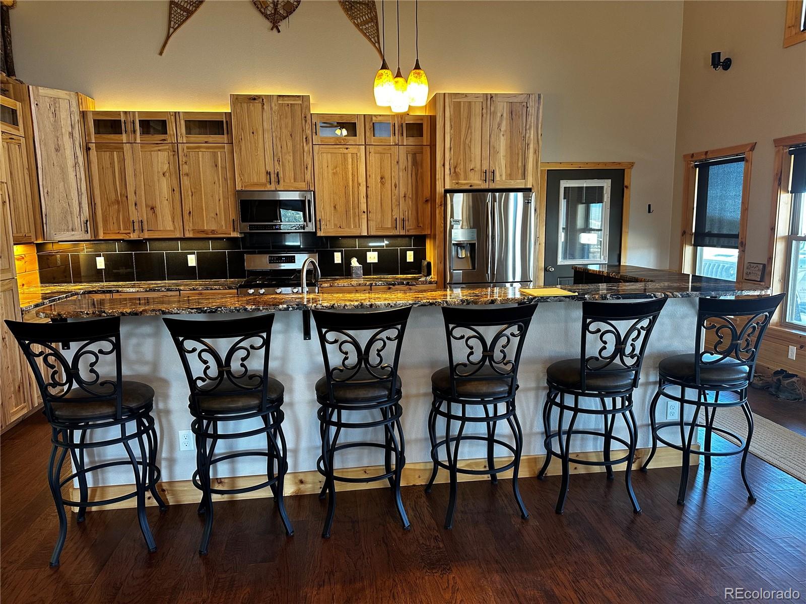 3744 Icehouse Road Fort Garland, CO 81133 - Photo 34 of 48 a view of a table and chairs in a patio