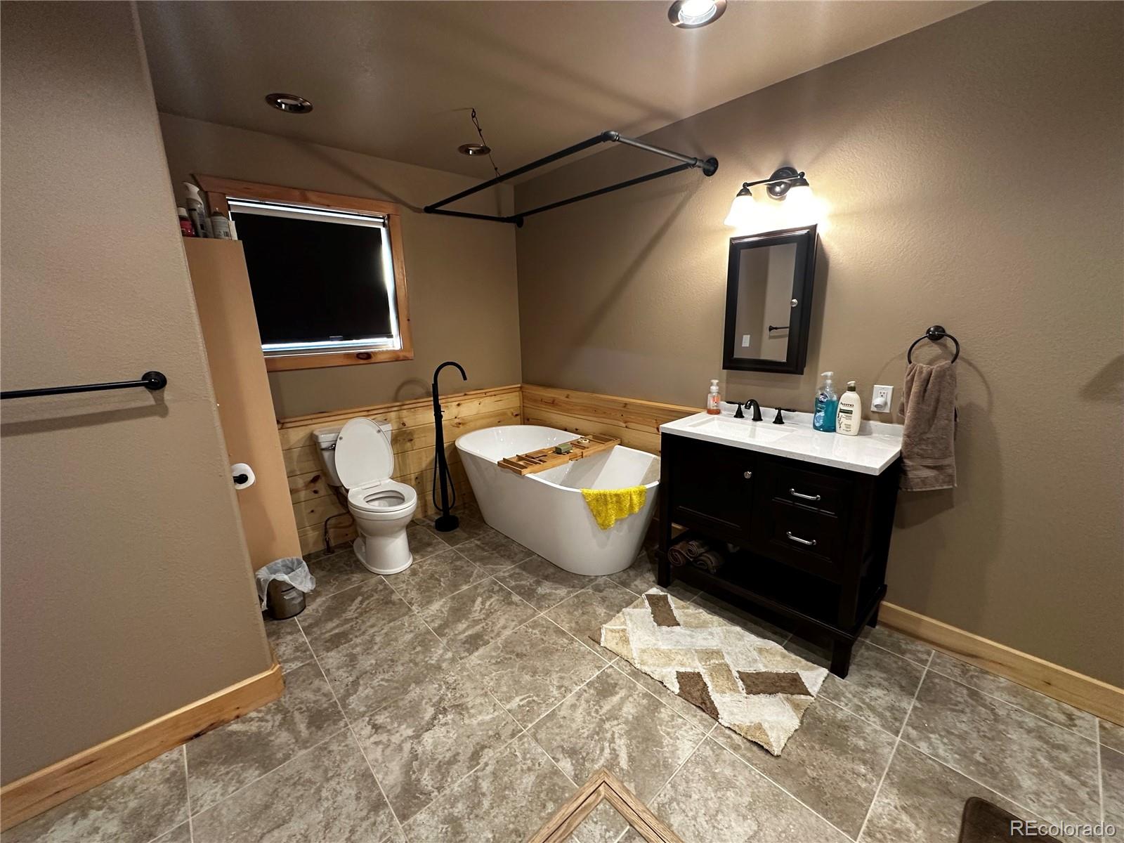 3744 Icehouse Road Fort Garland, CO 81133 - Photo 37 of 48 a living room with a couch and a flat screen tv