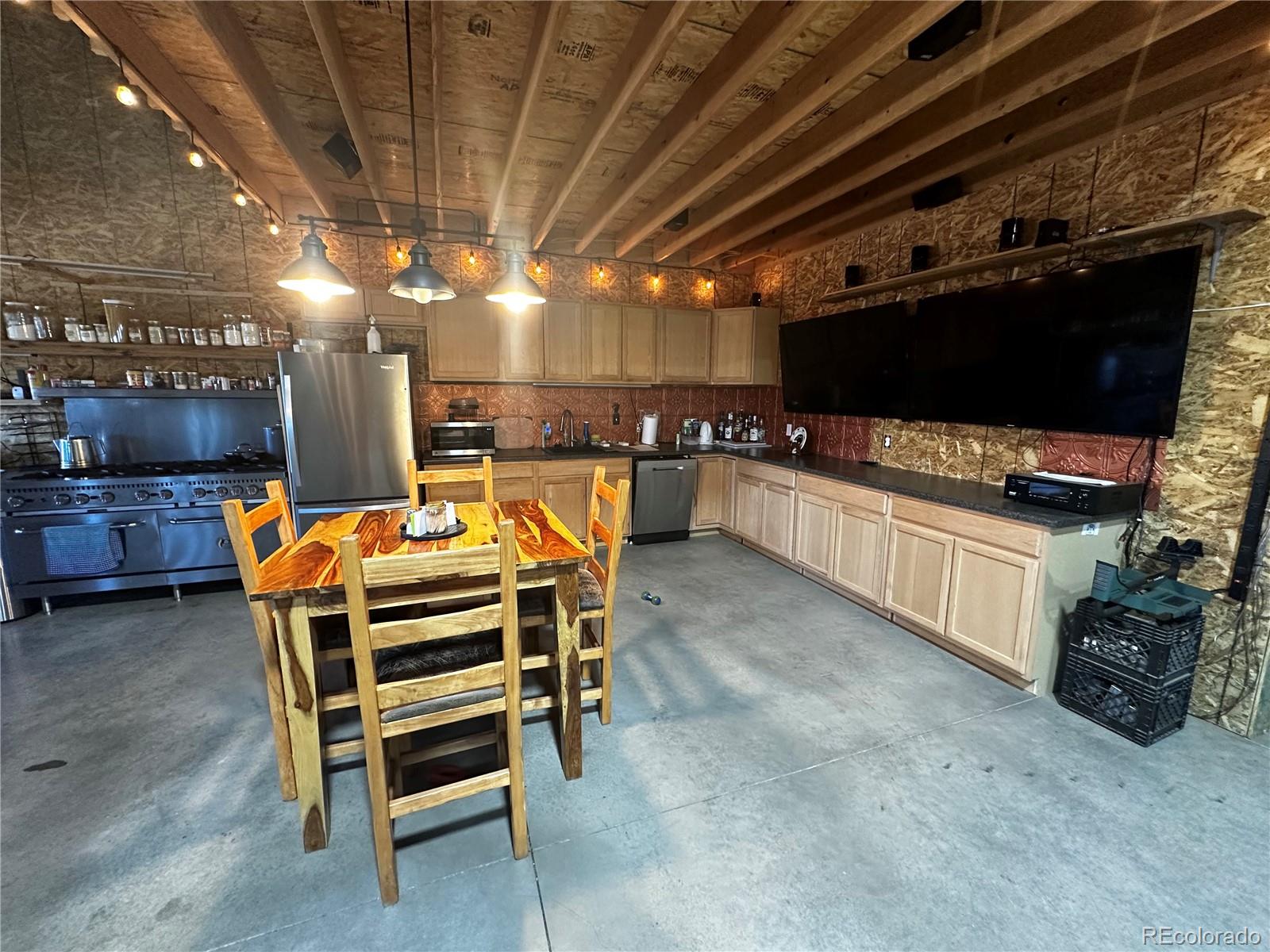 3744 Icehouse Road Fort Garland, CO 81133 - Photo 38 of 48 a room with furniture and a flat screen tv