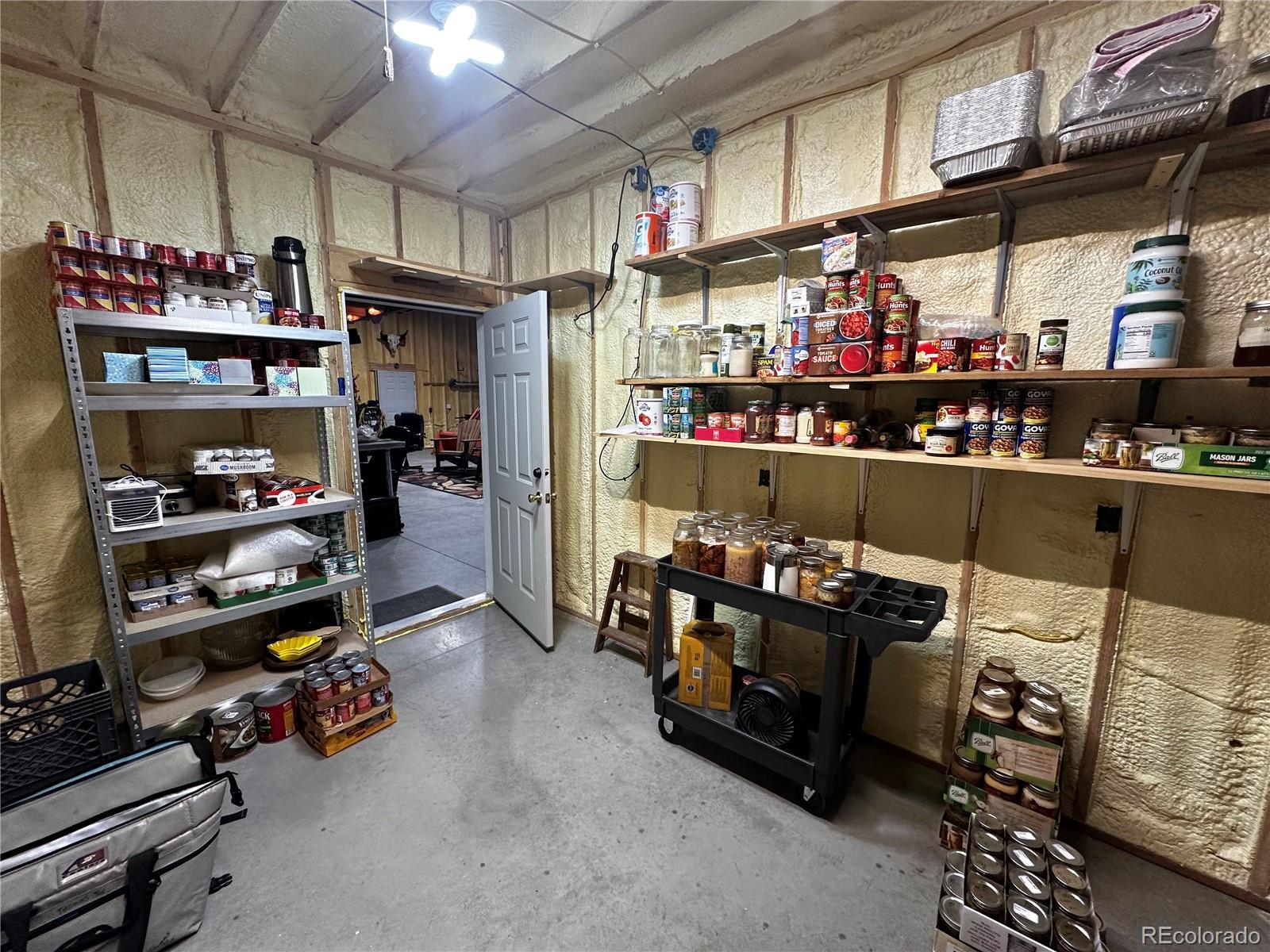 3744 Icehouse Road Fort Garland, CO 81133 - Photo 44 of 48 a room with lots of wooden furniture