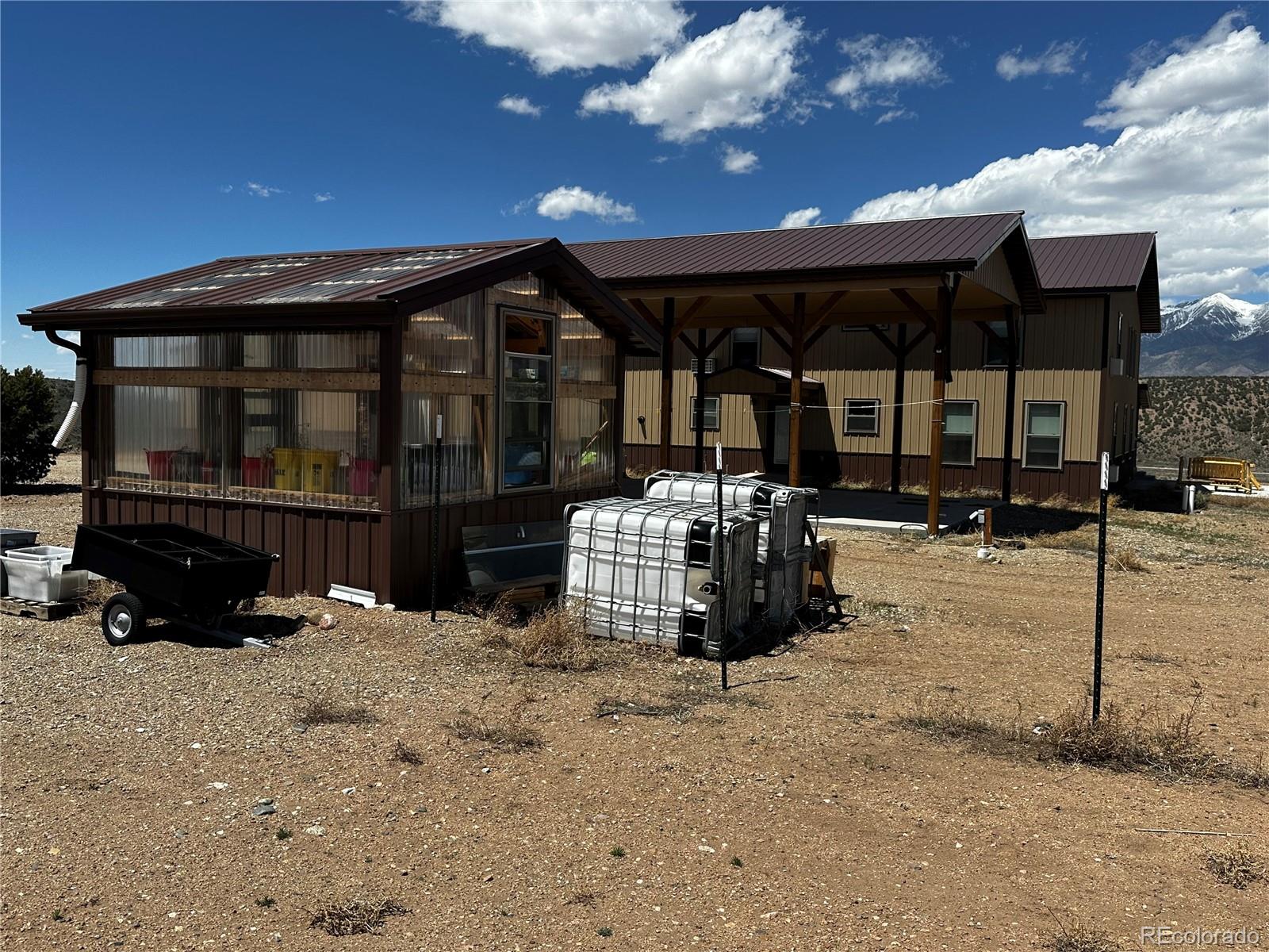 3744 Icehouse Road Fort Garland, CO 81133 - Photo 48 of 48 a view of a house with a yard