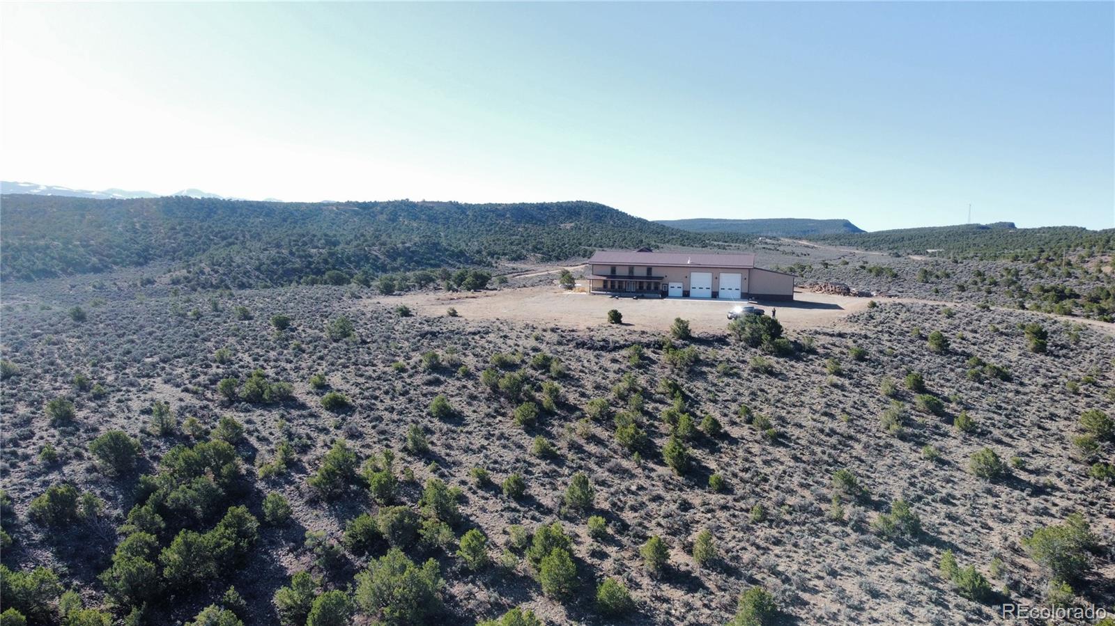3744 Icehouse Road Fort Garland, CO 81133 - Photo 8 of 48 a view of a dry field covered with fog