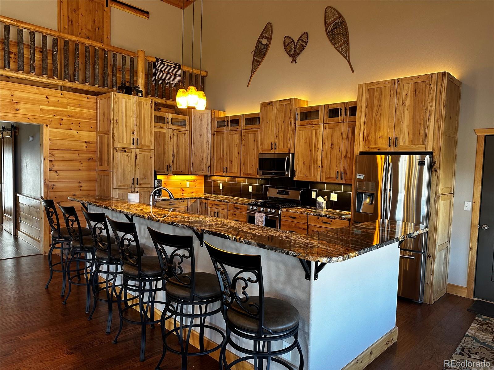 3744 Icehouse Road Fort Garland, CO 81133 - Photo 10 of 48 a dining table with chairs and wooden floor
