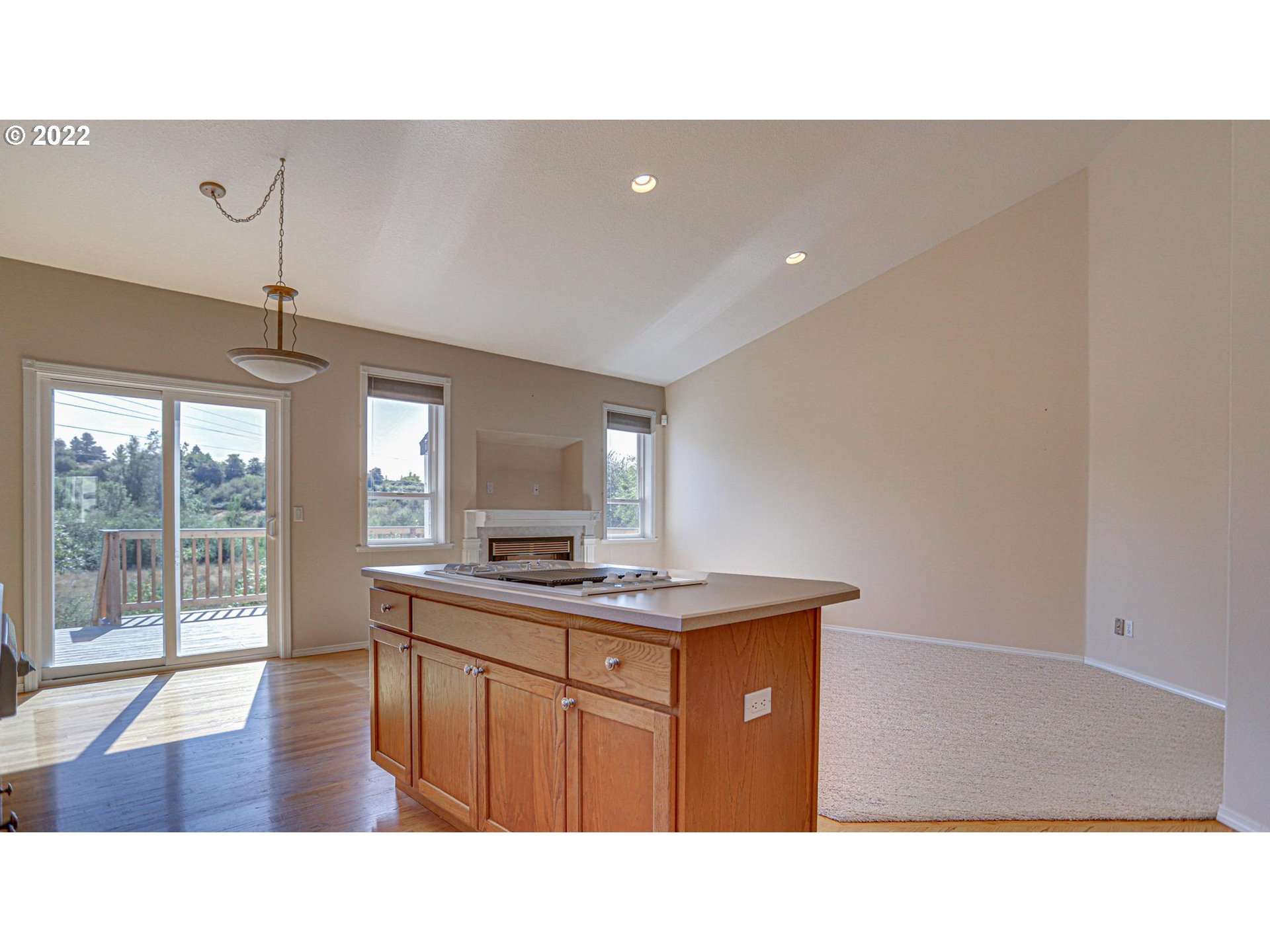 2388 Southwest Border Way Gresham, OR 97080 - Photo 3 of 29 a kitchen with a sink a counter top space and living room view