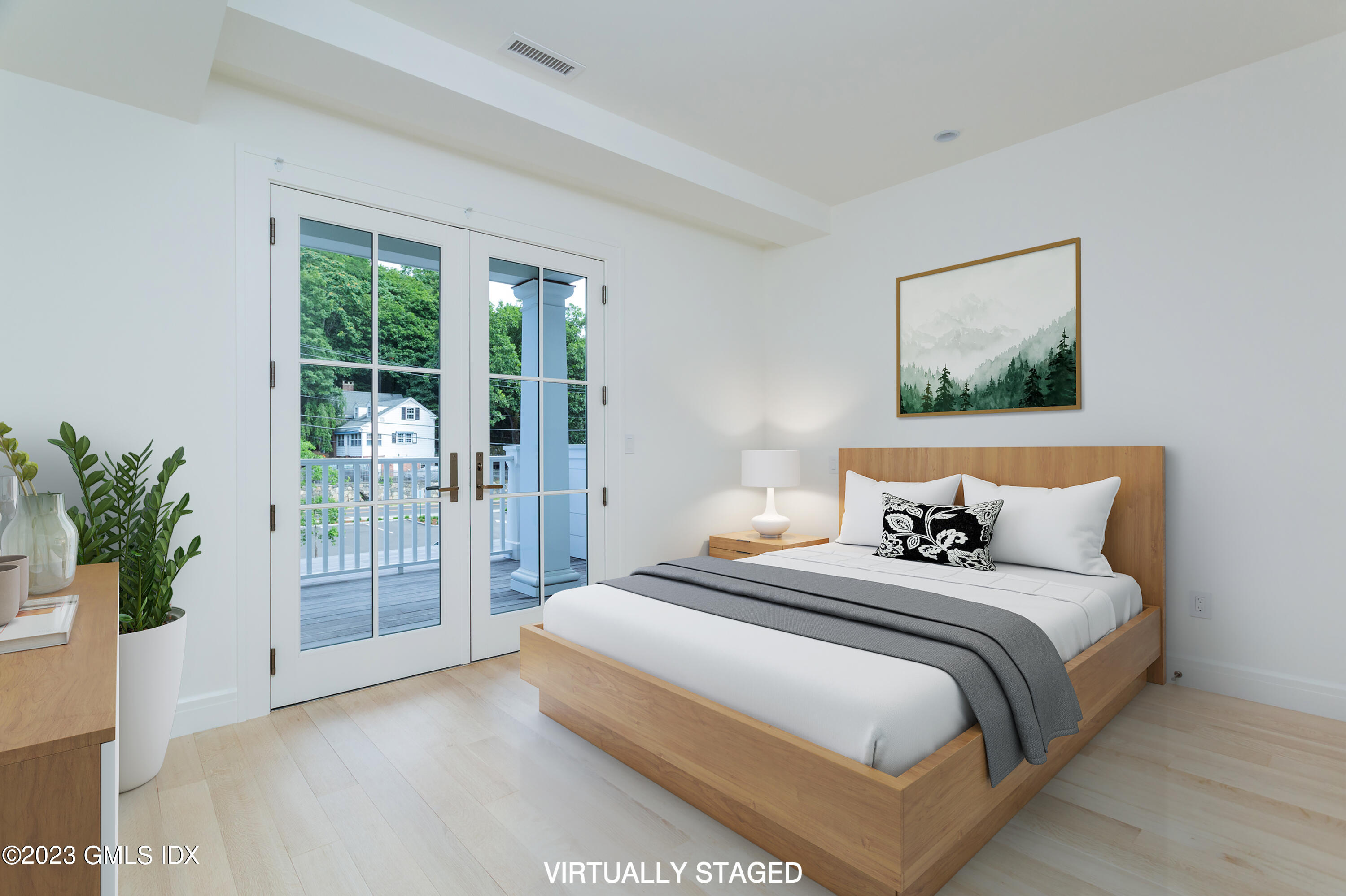 89 River Road, Unit 203 Cos Cob, CT 06807 - Photo 17 of 26 a bedroom with bed and glass window