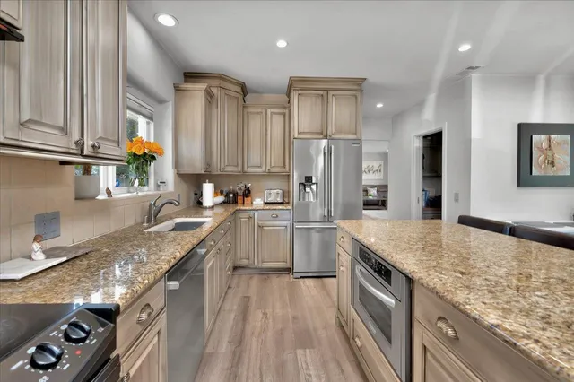 a bedroom with a bed and a table