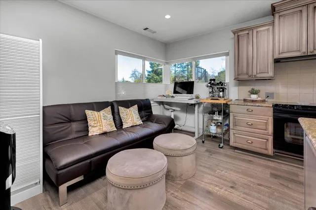 a bedroom with two beds and a large window