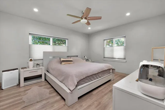 a view of a livingroom with furniture window and wooden floor