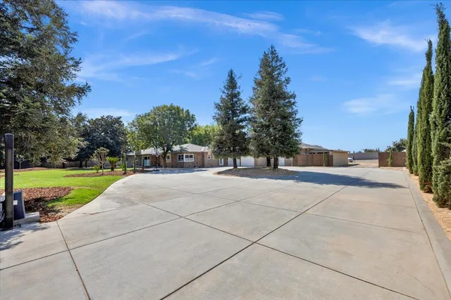 a backyard of a house with lots of green space