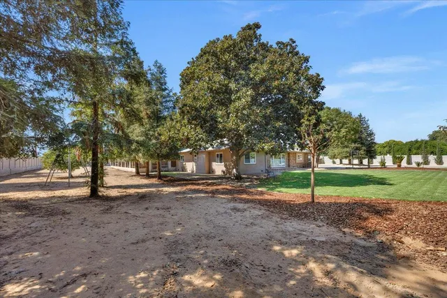 a view of a house with outdoor space and sitting area
