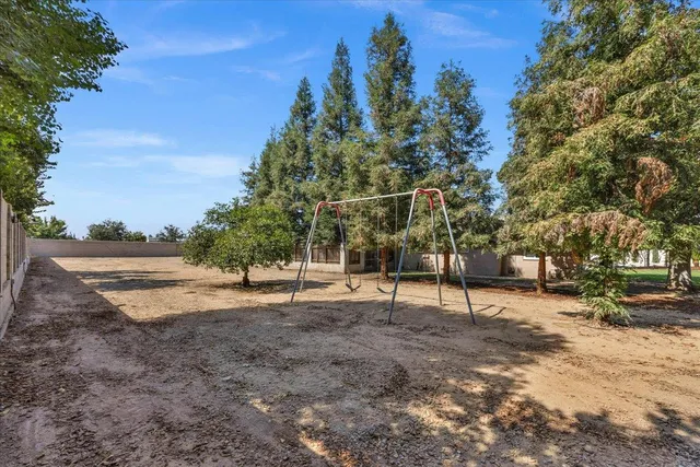 a view of a swimming pool with a yard