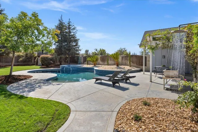 a view of a backyard of the house