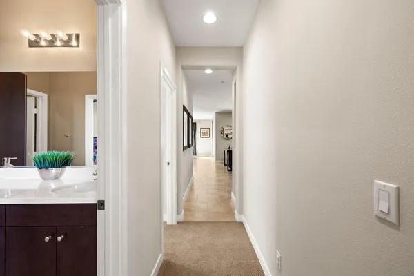a view of walk in closet with clothes