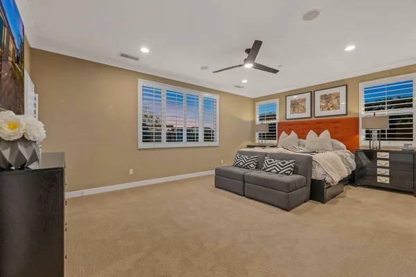 a bedroom with a bed and a lamp