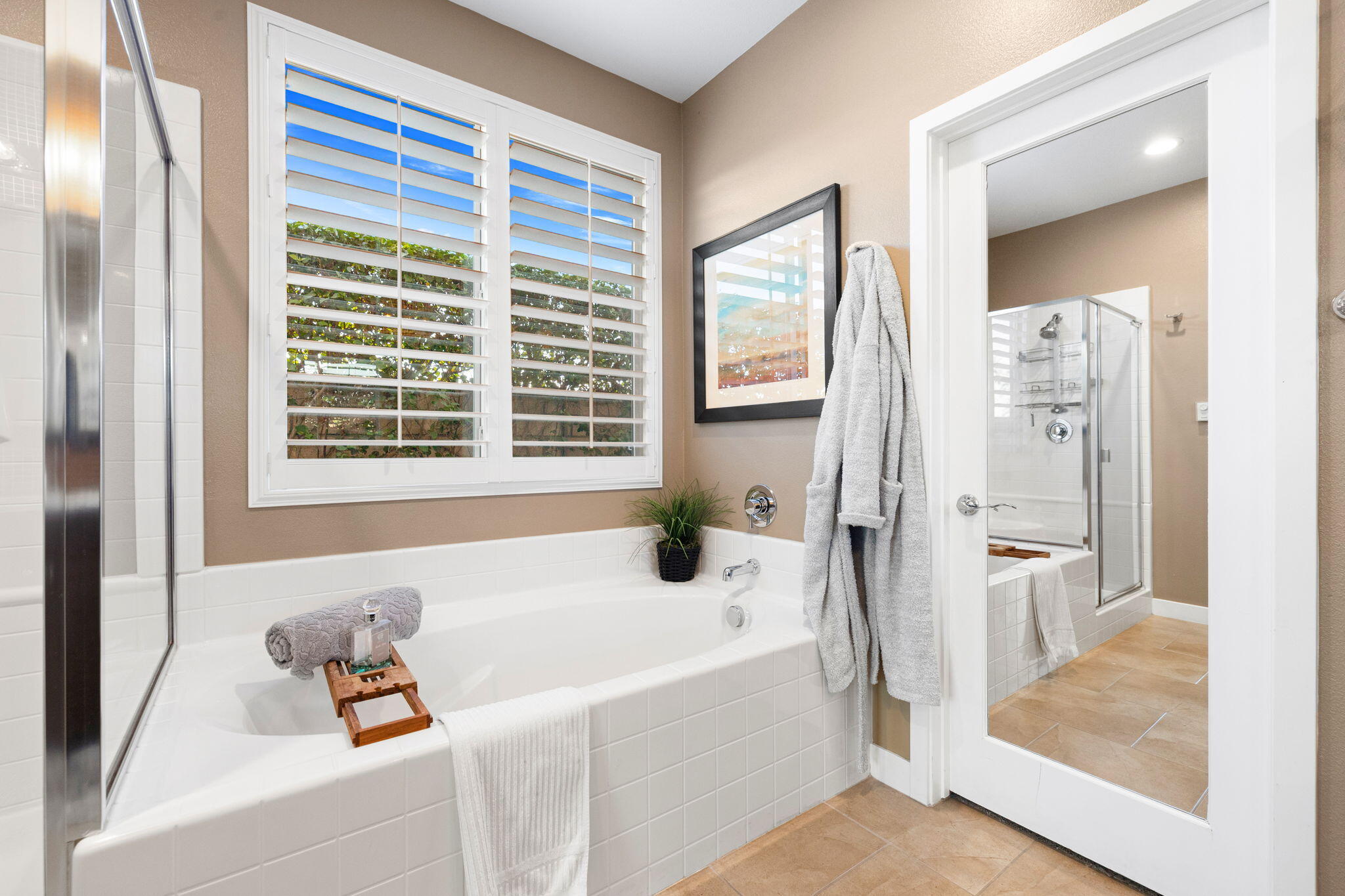 41371 Doyle Street Indio, CA 92203 - Photo 37 of 77 a bathroom with a bathtub and a shower