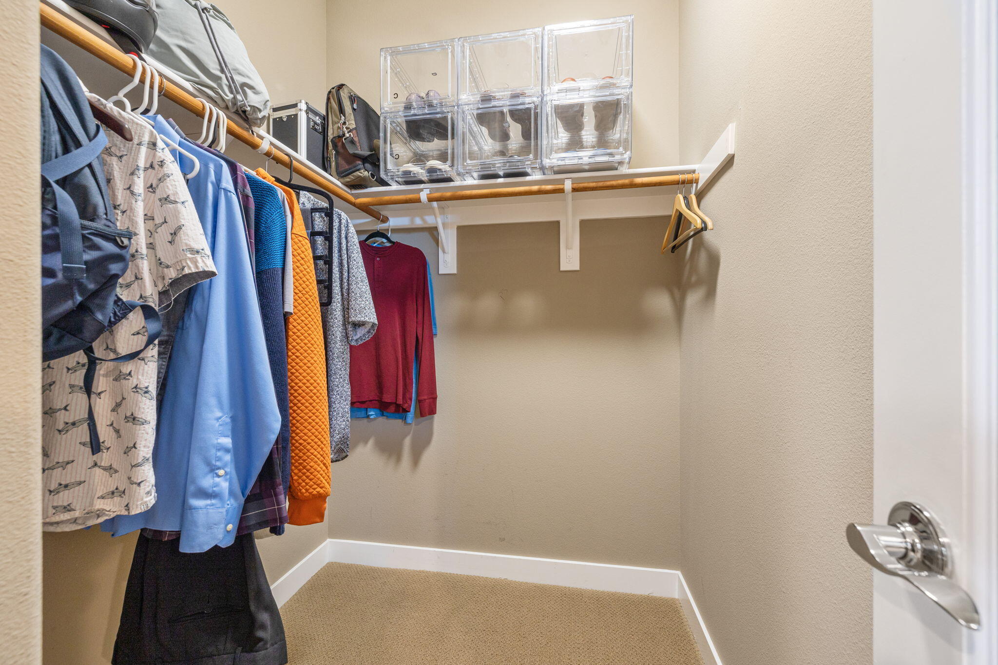 41371 Doyle Street Indio, CA 92203 - Photo 40 of 77 a view of walk in closet with clothes
