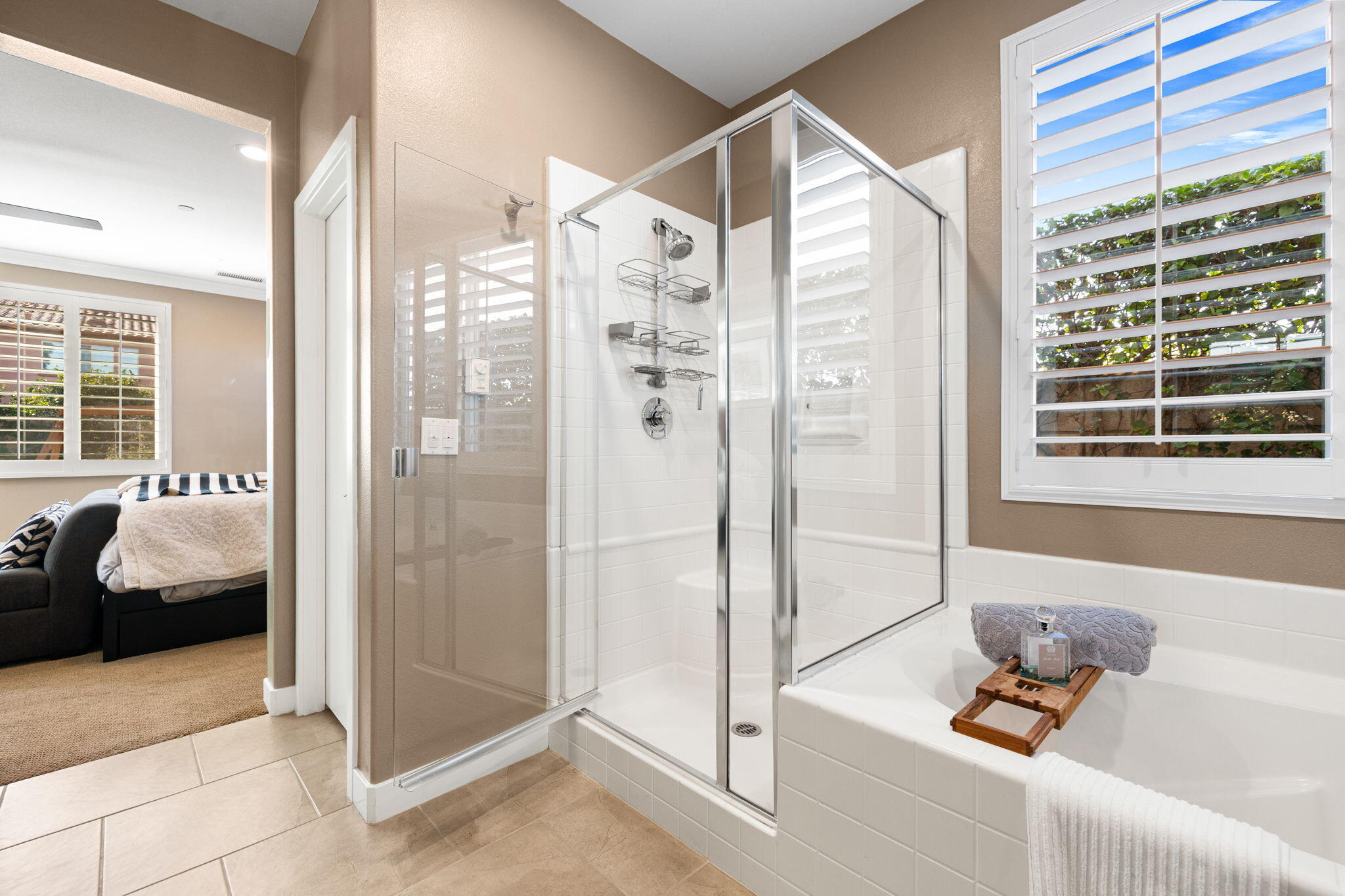 41371 Doyle Street Indio, CA 92203 - Photo 41 of 77 a bathroom with a tub shower and bedroom