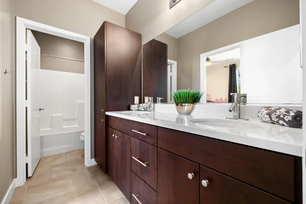 a view of a patio with dining table and chairs with wooden fence