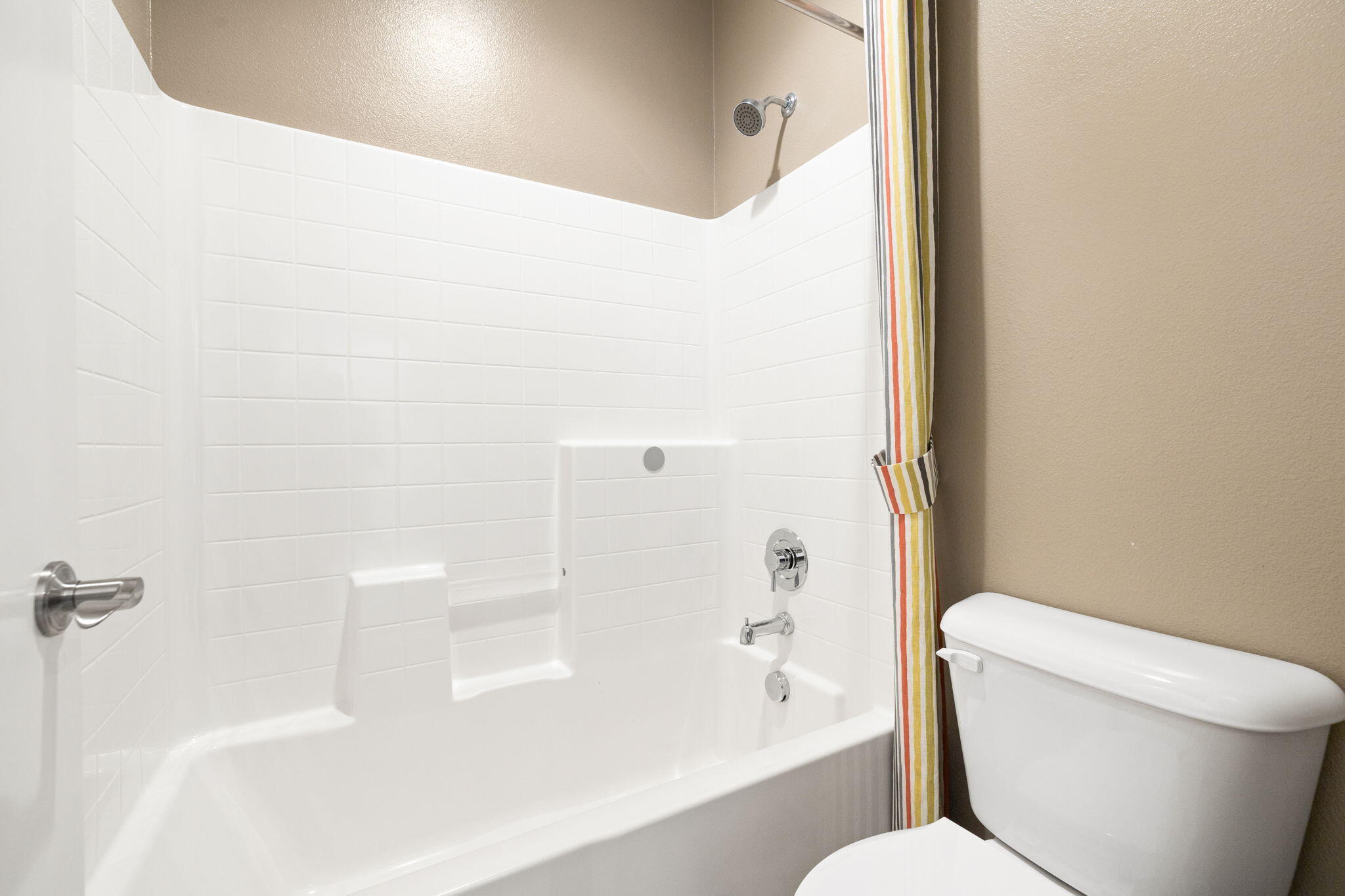 41371 Doyle Street Indio, CA 92203 - Photo 45 of 77 a bathroom with a toilet and a bathtub