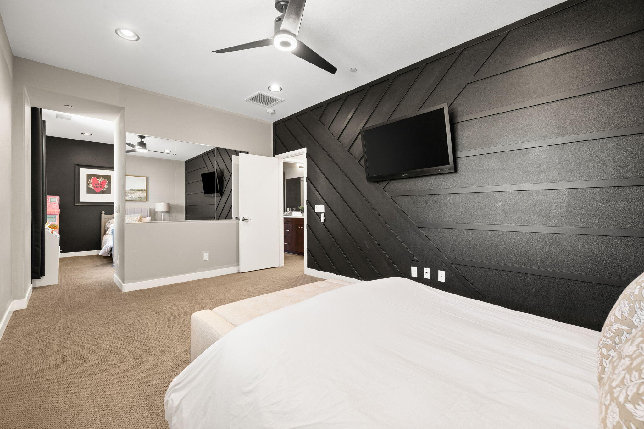 41371 Doyle Street Indio, CA 92203 - Photo 48 of 77 a bedroom with a bed and a flat screen tv
