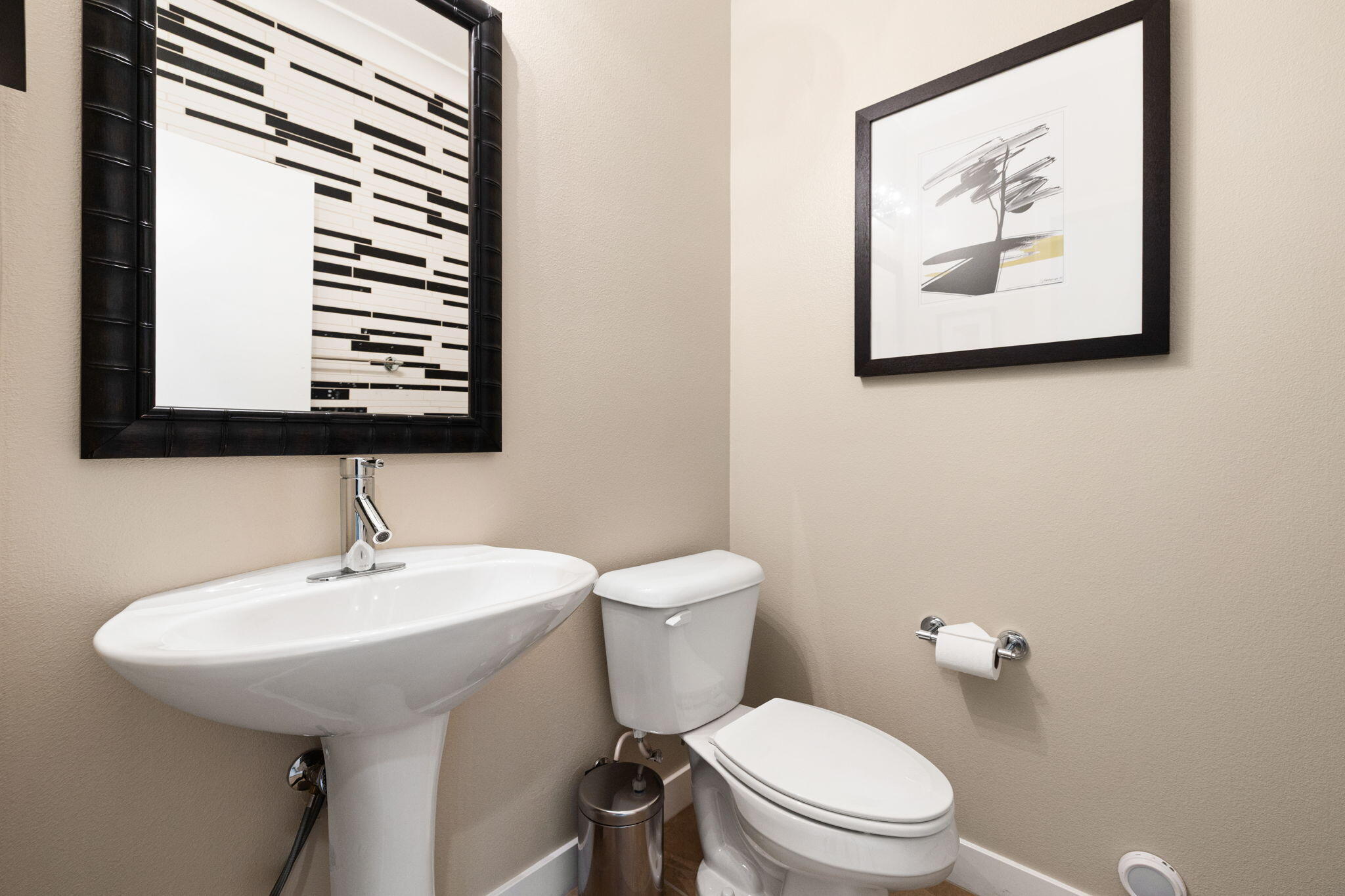 41371 Doyle Street Indio, CA 92203 - Photo 50 of 77 a bathroom with a toilet a sink and mirror