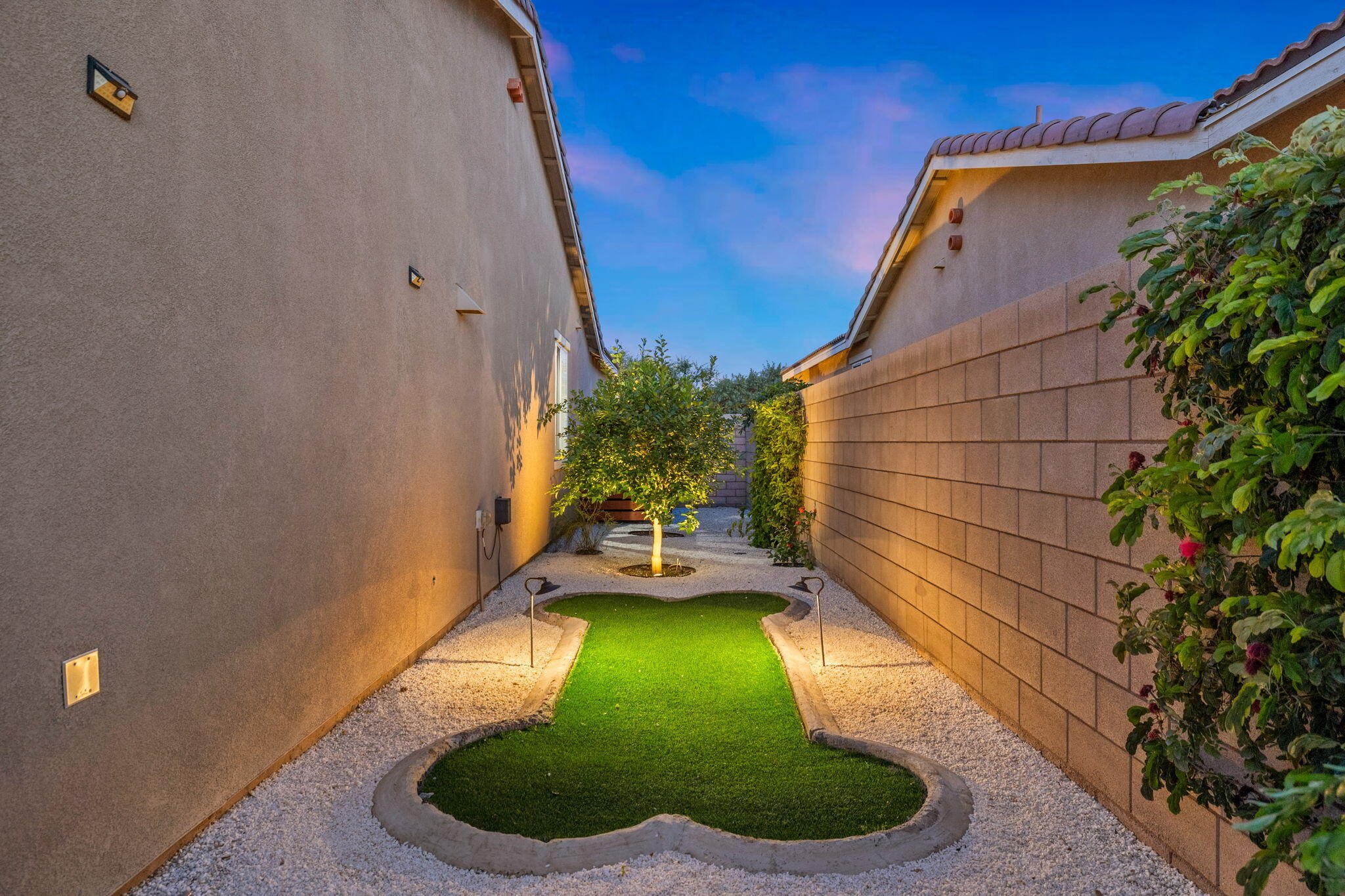 41371 Doyle Street Indio, CA 92203 - Photo 60 of 77 a backyard of a house with a yard and outdoor seating