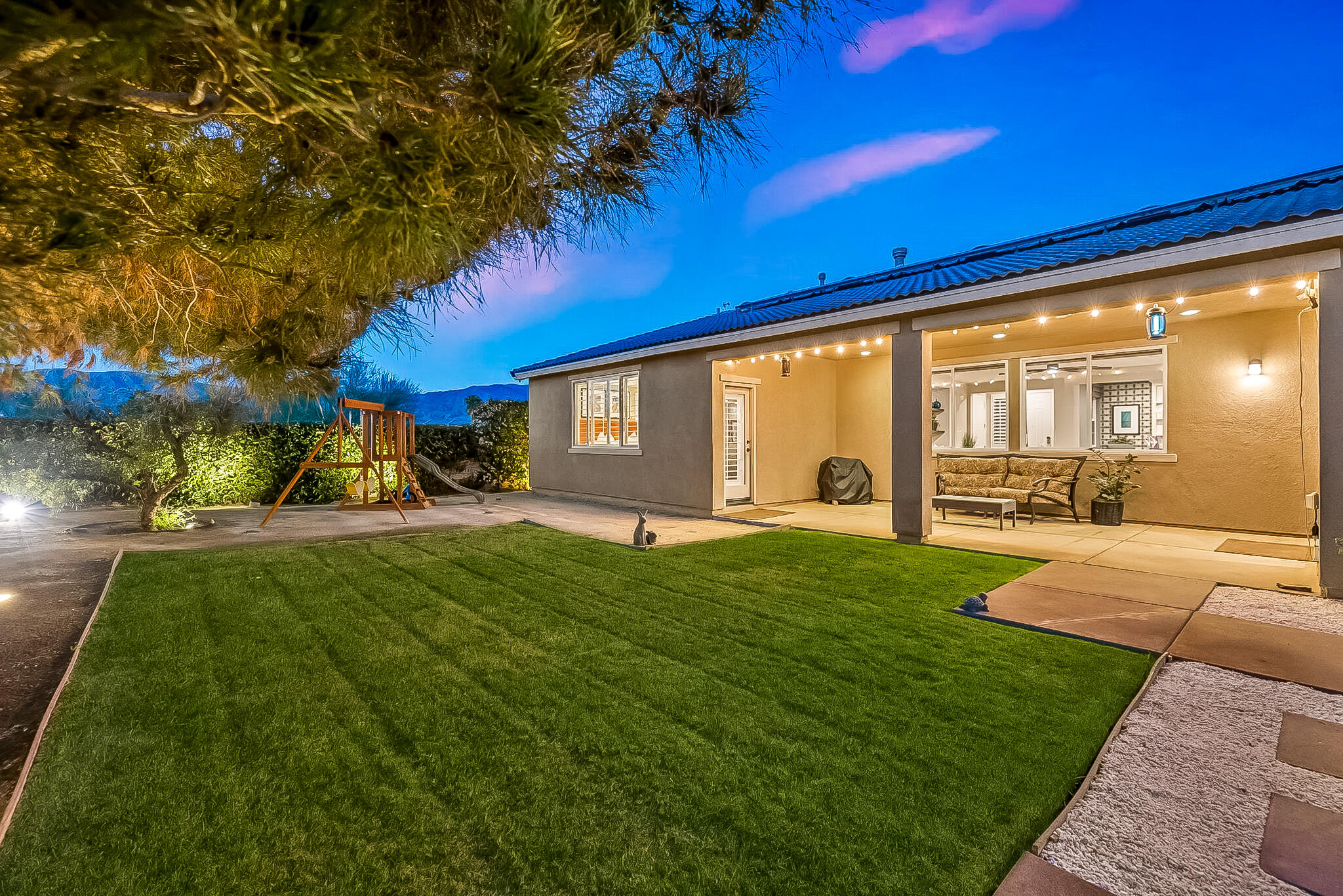 41371 Doyle Street Indio, CA 92203 - Photo 66 of 77 a view of a porch and garden