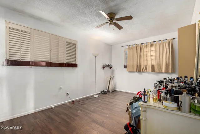 a bed room with a bed and a book shelf
