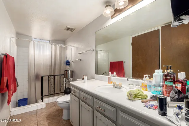 a living room with furniture a window and a flat screen tv