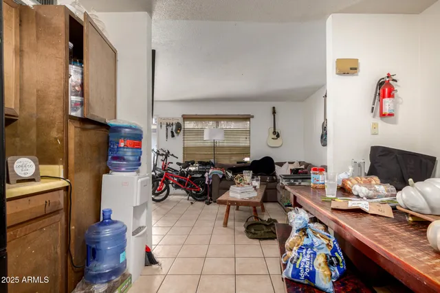 a kitchen with stainless steel appliances a stove refrigerator sink and microwave