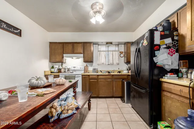 a living room with a bed and a table