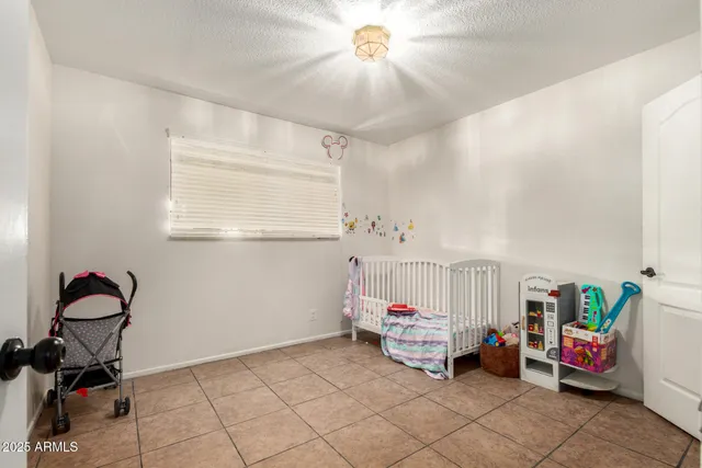 a bathroom with a sink a toilet and a shower curtain