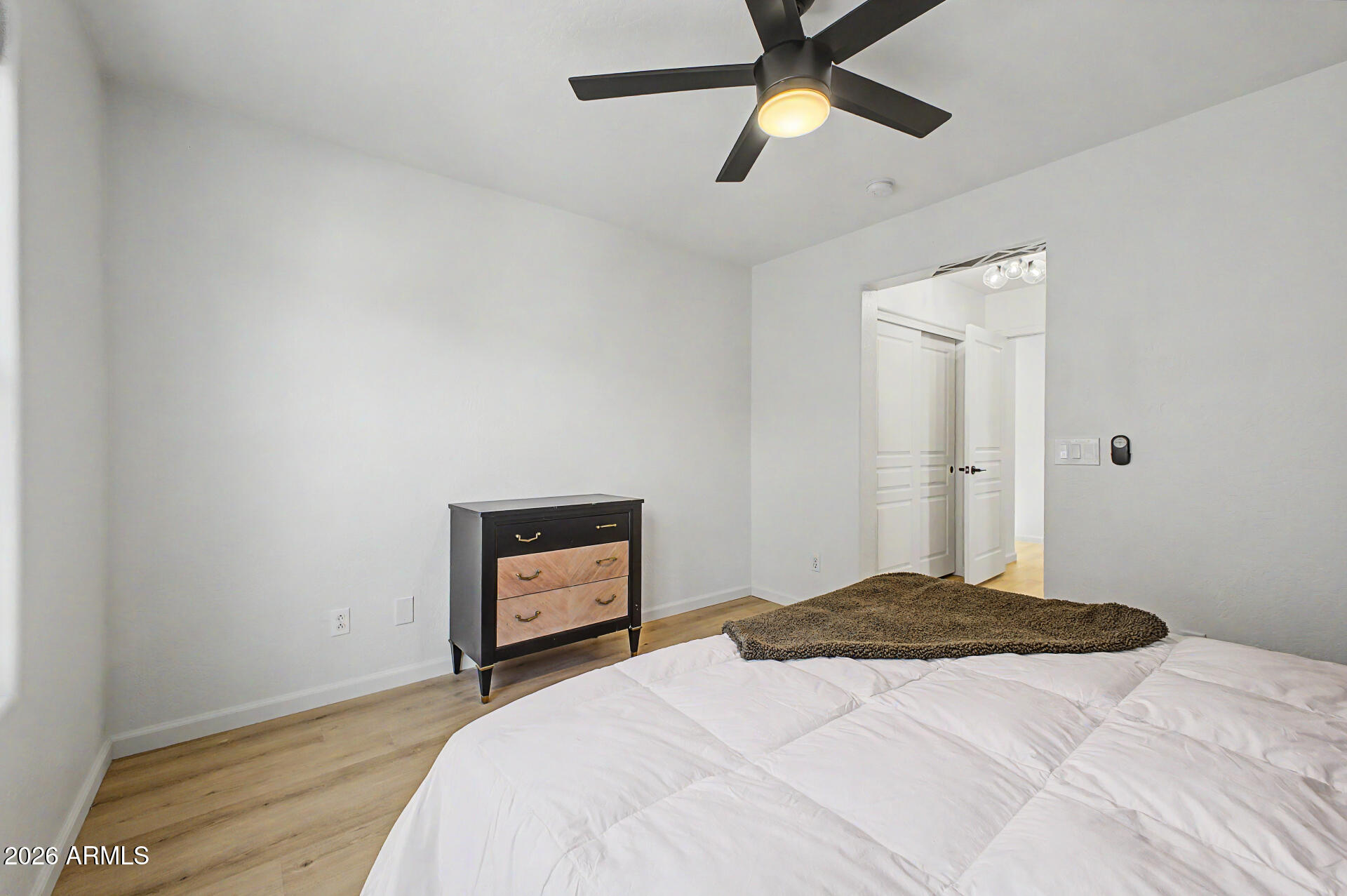 451 South Hawes Road, Unit 27 Mesa, AZ 85208 - Photo 13 of 27 a bedroom with a bed and a ceiling fan