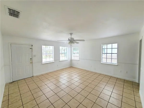 a view of an empty room and window