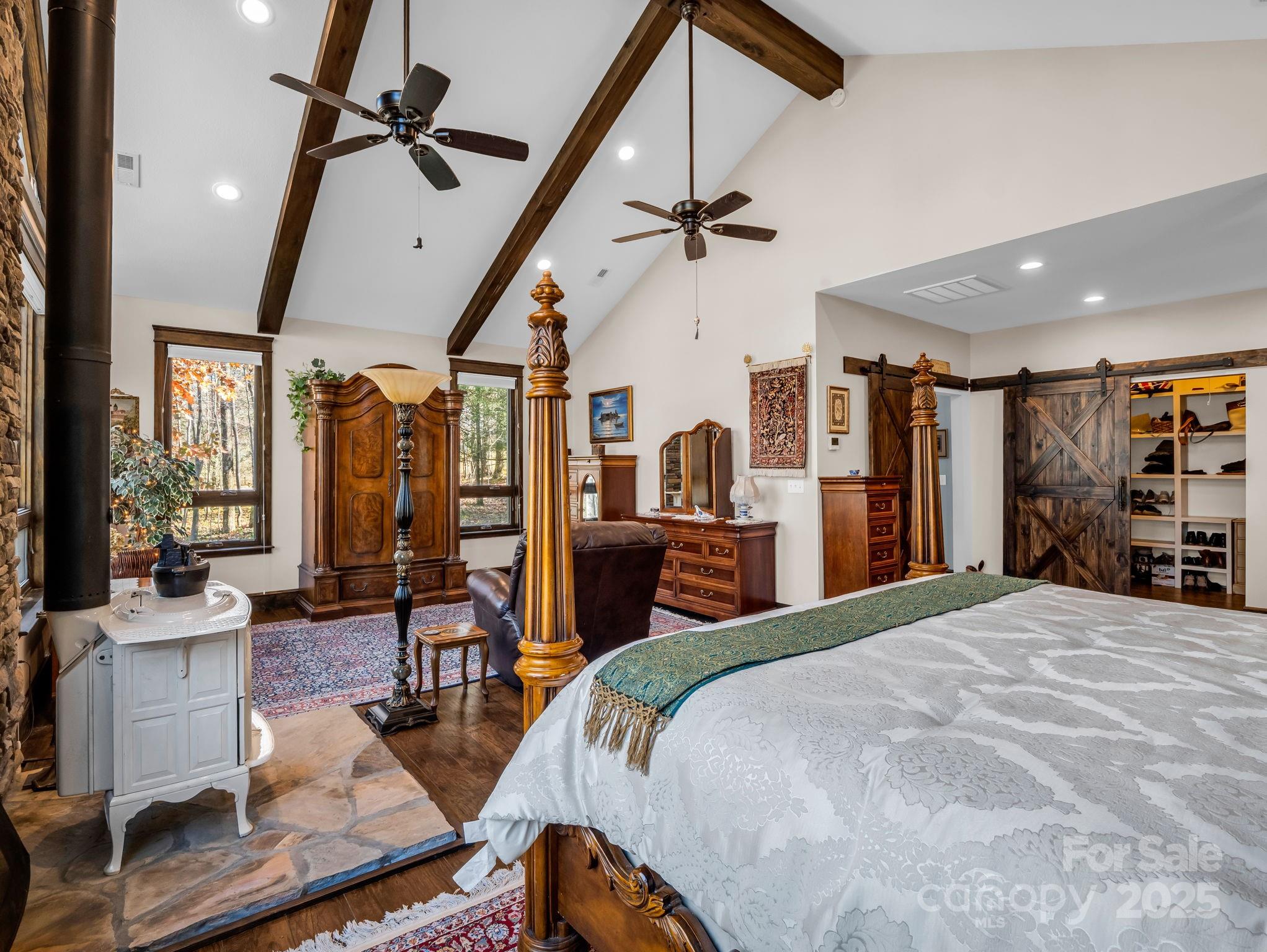 765 Higher Path Drive Saluda, NC 28773 - Photo 19 of 43 a bed room with a bed and a book shelf