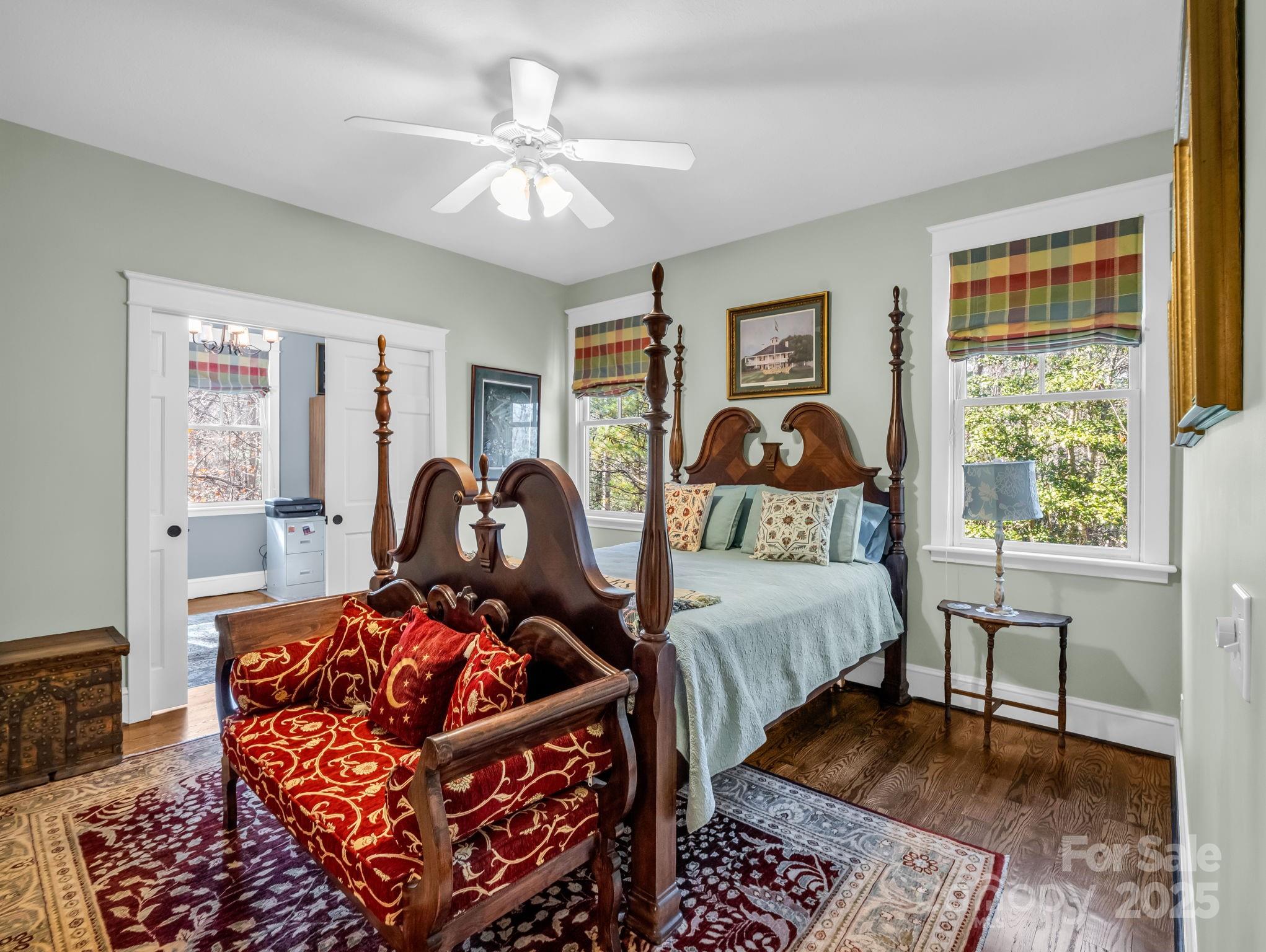 765 Higher Path Drive Saluda, NC 28773 - Photo 23 of 43 a bedroom with a bed and wooden floor