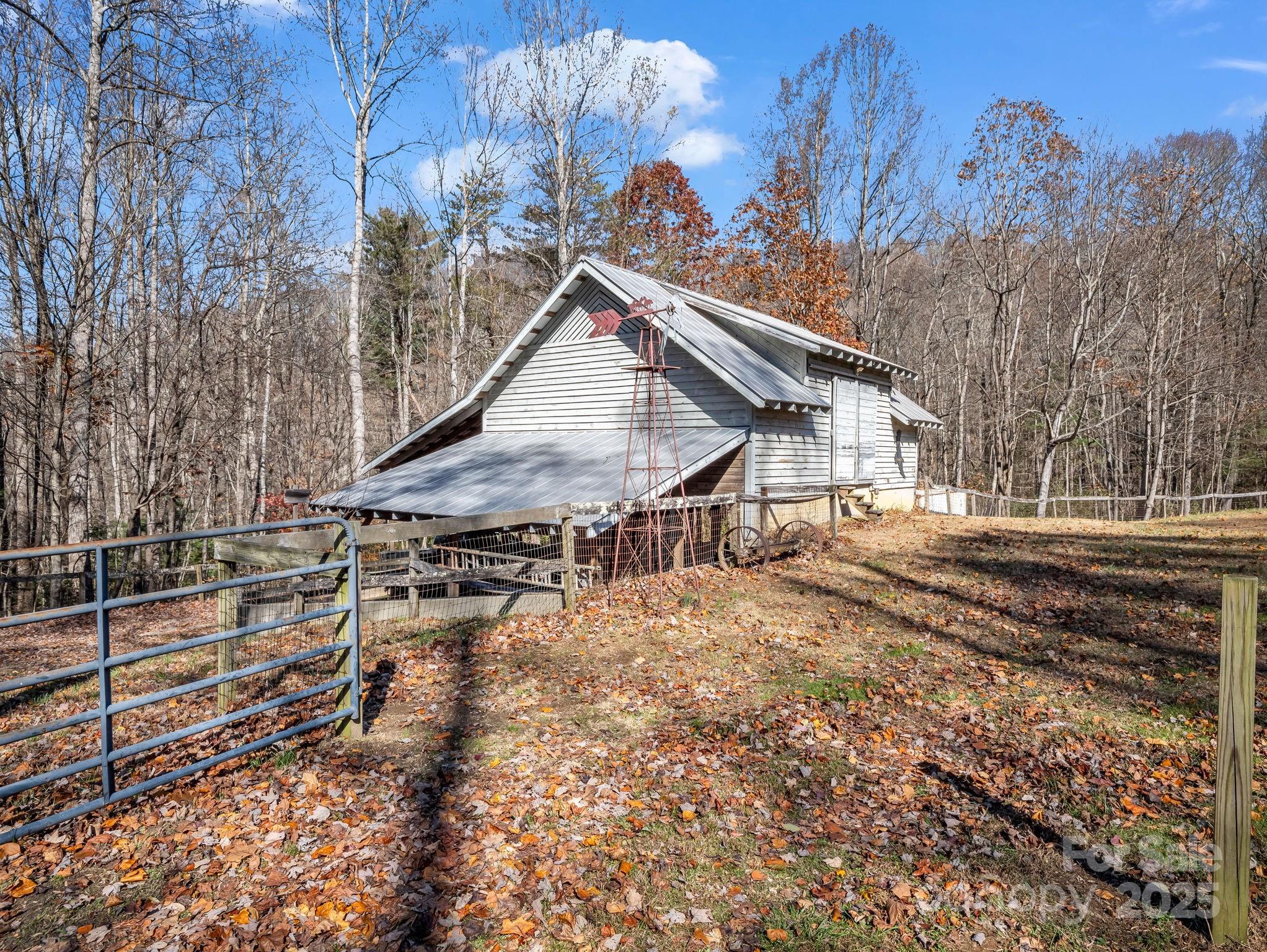 765 Higher Path Drive Saluda, NC 28773 - Photo 35 of 43 a view of a house with a snow on the wall